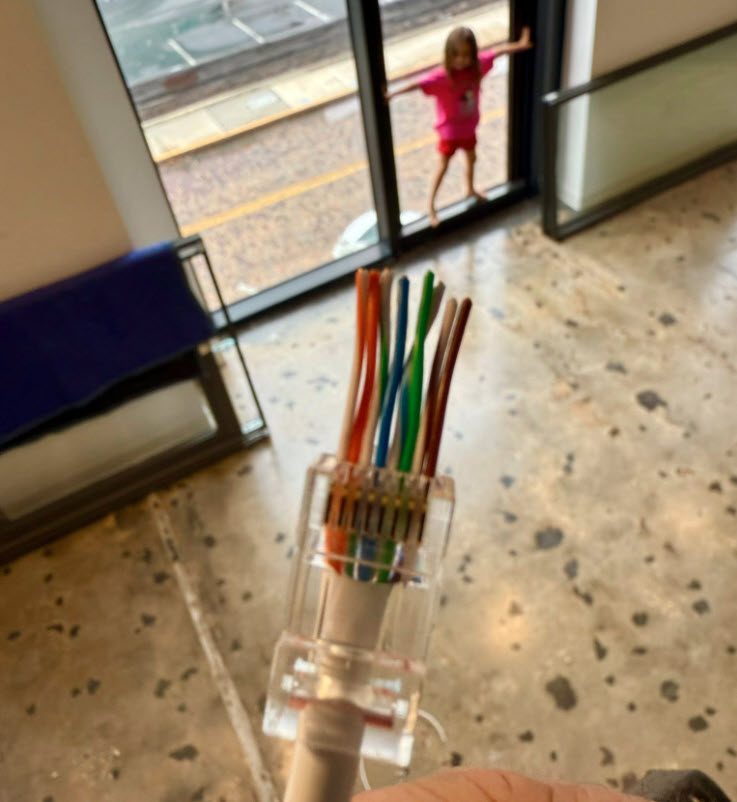 Custom Cat6 Ethernet cabling and RJ45 termination for an office relocation in downtown Orlando