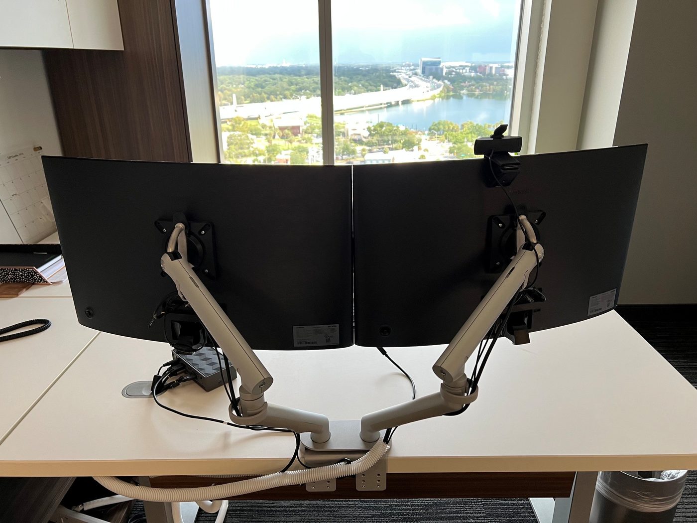 Professionally installed dual-monitor executive workstation setup