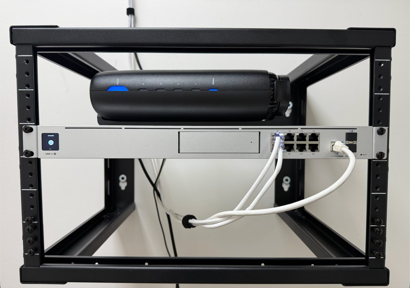 UniFi Dream Machine Special Edition and organized network rack installed for an office relocation in Maitland